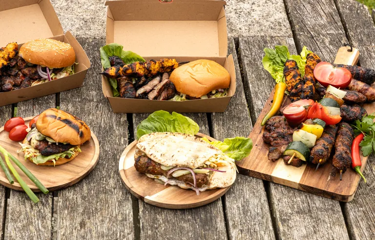 Balkan street-food feast with sandwiches and mixed grill