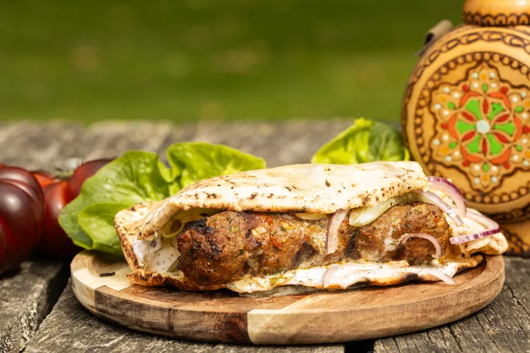 Balkan grilled-meat flatbread with fresh salad